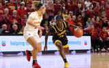 Chit-Chat Wright drives to the basket against an Iowa State defender. (Photo by Reese Strickland-Imagn Images)