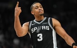 Nov 18, 2025; San Antonio, Texas, USA; San Antonio Spurs forward Keldon Johnson (3) celebrates in the second half against the Memphis Grizzlies at Frost Bank Center. Mandatory Credit: Daniel Dunn-Imagn Images
