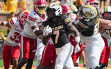 Marquise Davis scores a touchdon for Missouri, via Denny Medley-Imagn Images