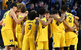 Michigan basketball tunnel photo huddle