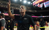 USC Trojans head coach Eric Musselman holds up Fight On sign after victory against the UTSA Roadrunners at the Galen Center