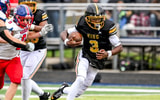 Detroit King's quarterback Darryl Flemister runs for a gain against Mason during the second quarter on Saturday, Nov. 23, 2024, at Chelsea High School. - Nick King, USA TODAY Sports