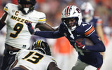 Oct 18, 2025; Auburn, Alabama, USA; Missouri Tigers defensive back Daylan Carnell (13) goes to tackle Auburn Tigers wide receiver Malcolm Simmons (4) during the first quarter at Jordan-Hare Stadium. Mandatory Credit: John Reed-Imagn Images