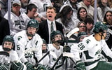 Michigan State's head coach Adam Nightingale, center, calls out to players during the third period in the game against Michigan on Friday, Dec. 5, 2025, at Munn Ice Arena in East Lansing. - Nick King, USA TODAY Sports