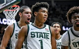 Michigan State's Jeremy Fears Jr., center, leaves the court with Jesse McCulloch, left, and Coen Carr, right, after Fears' shot to end the first half against Cornell on Monday, Dec. 29, 2025. - Nick King, USA TODAY Sports