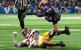 TCU Horned Frogs quarterback Ken Seals (9) carries the ball against USC Trojans linebacker Desman Stephens II (23) in the first half during the Alamo Bowl at Alamodome