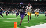 TCU Horned Frogs running back Jeremy Payne (26) scores on a 35-yard touchdown reception in overtime for the winning score against the USC Trojans during the Alamo Bowl at Alamodome