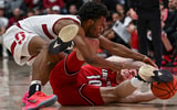 Jan 2, 2025; Stanford, California, USA; Stanford Cardinal guard Ebuka Okorie (1) and Louisville Cardinals guard Isaac McKneely (10) fight for a loose ball during the first half at Maples Pavilion. Mandatory Credit: Justine Willard-Imagn Images