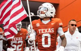 Sep 6, 2025; Austin, Texas, USA; Texas Longhorns wide receiver DeAndre Moore Jr. (0) leads players on to the field before the game against the San Jose State Spartans at Darrell K Royal-Texas Memorial Stadium. Mandatory Credit: Scott Wachter-Imagn Images