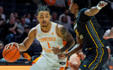 Tennessee guard Amari Evans (1) dribbles the ball in front of Northern Kentucky's Donovan Rakotonanahary (10) during a NCAA basketball game between the Tennessee Volunteers and Northern Kentucky Norse at Thompson-Boling Arena at Food City Center on Nov. 8, 2025.