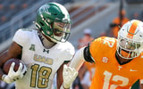 Sep 20, 2025; Knoxville, Tennessee, USA; UAB Blazers wide receiver Xavier Daisy (18) runs the ball against Tennessee Volunteers linebacker Jaedon Harmon (12) during the second half at Neyland Stadium. Mandatory Credit: Randy Sartin-Imagn Images