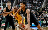 Michigan State's Divine Ugochukwu, right, moves the ball as USC's Jordan Marsh defends during the first half on Monday, Jan. 5, 2026, at the Breslin Center in East Lansing. - Nick King, USA TODAY Sports