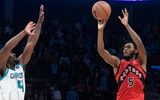Jan 7, 2026; Charlotte, North Carolina, USA; Toronto Raptors guard Immanuel Quickley (5) shoots the game winning shot with less than 1 second remaining as he is defended by Charlotte Hornets guard Sion James (4) during the second half at the Spectrum Center. Mandatory Credit: Sam Sharpe-Imagn Images