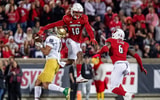 Louisville's Ben Perry (10) jumped to break up a pass during first half action as the Louisville Cardinals battled the Notre Dame Fighting Irish on Saturday, Oct. 7, 2023.