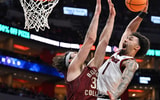 Jan 10, 2026; Louisville, Kentucky, USA; Louisville Cardinals guard J'vonne Hadley (1) attempts to dunk against Boston College Eagles center Boden Kapke (33) during the second half at KFC Yum! Center. Mandatory Credit: Jamie Rhodes-Imagn Images