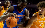 Florida center Rueben Chinyelu (9) get pressure from Tennessee guard Ja'kobi Gillespie (0) during first half of an NCAA basketball at Steven C. O'Connell Center Exactek arena in Gainesville, FL on Saturday, January 10, 2026. [Alan Youngblood/Gainesville Sun]