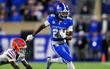Nov 8, 2025; Lexington, Kentucky, USA; Kentucky Wildcats running back Jason Patterson (26) carries the ball during the fourth quarter against the Florida Gators at Kroger Field. Mandatory Credit: Jordan Prather-Imagn Images