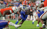 Sep 20, 2025; Miami Gardens, Florida, USA; Florida Gators running back Ja'Kobi Jackson (24) carries the football against the Miami Hurricanes during the third quarter at Hard Rock Stadium. Mandatory Credit: Sam Navarro-Imagn Images