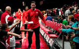 Ohio State Buckeyes head coach Kevin McGuff high-fives fans after defeating Norfolk State Spartans in the NCAA basketball game at Value City Arena on Thursday, Dec. 18, 2025 in Columbus, Ohio.