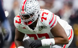 Jan 20, 2025; Atlanta, GA, USA; Ohio State Buckeyes offensive lineman Tegra Tshabola (77) against the Notre Dame Fighting Irish during the CFP National Championship college football game at Mercedes-Benz Stadium. Mandatory Credit: Mark J. Rebilas-Imagn Images