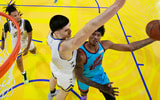 February 14, 2025; San Francisco, California, USA; Team G-League guard Dink Pate (1) of the Mexico City Capitanes drives to the basket against Team C forward Zach Edey (14) of the Memphis Grizzlies during the 2025 NBA Rising Stars Game at Chase Center. Mandatory Credit: Kyle Terada-Imagn Images