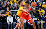 Michigan forward Yaxel Lendeborg (23) defends Ohio State forward Amare Bynum (1) during the first half at Crisler Center in Ann Arbor on Friday, Jan. 23, 2026.