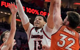 Jan 24, 2026; Louisville, Kentucky, USA; Louisville Cardinals forward Sananda Fru (13) shoots against Virginia Tech Hokies center Christian Gurdak (32) and Virginia Tech Hokies guard Neoklis Avdalas (17) during the first half at KFC Yum! Center. Mandatory Credit: Jamie Rhodes-Imagn Images