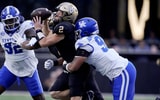 Vanderbilt quarterback Diego Pavia (2) is brought down from behind by Kentucky defensive lineman Mi'Quise Humphrey-Grace (90) during the second quarter at FirstBank Stadium in Nashville, Tenn., Saturday, Nov. 22, 2025. (© Mark Zaleski / The Tennessean / USA TODAY NETWORK via Imagn Images)