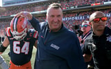 Sep 27, 2025; Champaign, Illinois, USA; Illinois Fighting Illini head coach Bret Bielema gives players a hand after a 34-32 win against the Southern California Trojans at Memorial Stadium. Mandatory Credit: Ron Johnson-Imagn Images