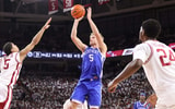 Jan 31, 2026; Fayetteville, Arkansas, USA; Kentucky Wildcats guard Collin Chandler (5) shoots as Arkansas Razorbacks guard Darius Acuff Jr (5) defends during the first half at Bud Walton Arena. Kentucky won 85-77. Mandatory Credit: Nelson Chenault-Imagn Images