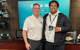 OT Caleb Johnson with Michigan State HC Pat Fitzgerald (photo via Johnson social media)