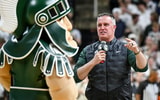 Michigan State's new football coach Pat Fitzgerald addresses the crowd during a timeout in the first half of the Spartans basketball game against Iowa on Tuesday, Dec. 2, 2025, at the Breslin Center. - Nick King, USA TODAY Sports