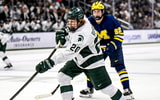 Michigan State's Daniel Russell shoots the puck against Michigan during the third period on Friday, Dec. 5, 2025, at Munn Ice Arena in East Lansing. - Nick King, USA TODAY Sports