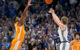 Kentucky's guard Collin Chandler (5) scores a three to give them the lead against Tennessee's forward Jaylen Carey (23) at Rupp Arena Saturday night. Feb. 7, 2026