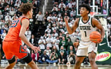 Michigan State's Jeremy Fears Jr., right, signals to teammates as Illinois' Keaton Wagler defends during the second half on Saturday, Feb. 7, 2026, at the Breslin Center in East Lansing. - Nick King, USA TODAY Sports