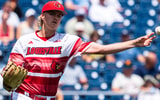 Jun 15, 2025; Omaha, Neb, USA; Louisville Cardinals starting pitcher Ethan Eberle (51) throws to first for an out against the Arizona Wildcats during the fourth inning at Charles Schwab Field. Mandatory Credit: Dylan Widger-Imagn Images