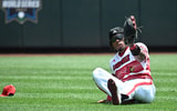 Jun 15, 2025; Omaha, Neb, USA; Louisville Cardinals left fielder Zion Rose (32) makes a sliding play against the Arizona Wildcats during the second inning at Charles Schwab Field. Mandatory Credit: Steven Branscombe-Imagn Images