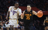Feb 14, 2026; Knoxville, Tennessee, USA;  Tennessee Volunteers guard Ethan Burg (35) brings the ball up court against Louisiana State Tigers guard PJ Carter (7) during the first half at Thompson-Boling Arena at Food City Center. Mandatory Credit: Randy Sartin-Imagn Images