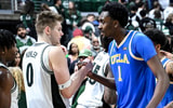 Michigan State's Jaxon Kohler, left, shakes hands with former teammate UCLA's Xavier Booker after the game on Tuesday, Feb. 17, 2026, at the Breslin Center in East Lansing. - Nick King, USA TODAY Sports