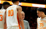 Tennessee basketball coach Rick Barnes huddles with Tennessee forwards Jaylen Carey (23) and Nate Ament (10), and guard Ethan Burg (35) during an NCAA college basketball game against Oklahoma on Feb. 18, 2026, in Knoxville, Tennessee.
