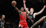 Feb 9, 2026; Brooklyn, New York, USA; Chicago Bulls guard Rob Dillingham (7) goes to the basket against Brooklyn Nets forward Danny Wolf (2) during the first half at Barclays Center. Mandatory Credit: Vincent Carchietta-Imagn Images