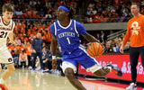 Feb 21, 2026; Auburn, Alabama, USA; Kentucky Wildcats guard Denzel Aberdeen (1) runs a play against the Auburn Tigers during the first half at Neville Arena. Mandatory Credit: John Reed-Imagn Images