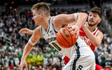Michigan State's Jaxon Kohler, left, moves around Ohio State's Ivan Niegovan on his way to a score during the second half on Sunday, Feb. 22, 2026, at the Breslin Center in East Lansing. - Nick King, USA TODAY Sports