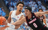 Feb 23, 2026; Chapel Hill, North Carolina, USA; North Carolina Tar Heels guard Seth Trimble (7) is fouled byLouisville Cardinals guard Mikel Brown Jr. (0) in the second half at Dean E. Smith Center. Mandatory Credit: Bob Donnan-Imagn Images