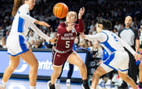 South Carolina Gamecocks guard Tessa Johnson (5) tries to get past Kentucky Wildcats forward Amelia Hassett (32) and guard Asia Boone (8) during the first quarter at Memorial Coliseum. Mandatory Credit: Arden Barnes-Imagn Images