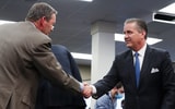 Kentucky athletic director Mitch Barnhart shakes John Calipari's hand, via Sam Upshaw Jr.:Courier Journal : USA TODAY NETWORK