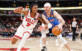 Mar 3, 2026; Chicago, Illinois, USA; Chicago Bulls guard Rob Dillingham (7) defends against Oklahoma City Thunder guard Alex Caruso (9) during the second half at United Center. Mandatory Credit: Kamil Krzaczynski-Imagn Images
