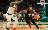 Mar 7, 2026; Coral Gables, Florida, USA; Louisville Cardinals guard Ryan Conwell (3) dribbles the ball against Miami Hurricanes forward Shelton Henderson (7) at Watsco Center. Mandatory Credit: Jeff Romance-Imagn Images