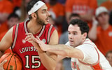 Louisville Cardinals center Aly Khalifa (15) is defended by Clemson Tigers forward Nick Davidson (11) Saturday, Feb. 28, 2026, during the NCAA men’s basketball game at Littlejohn Coliseum in Clemson, South Carolina. Clemson Tigers won 80-75.