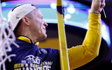 Mar 8, 2026; Ann Arbor, Michigan, USA; Michigan Wolverines head coach Dusty May cuts down the net to celebrate the regular season Big Ten Championship after the game against the Michigan State Spartans at Crisler Center. Mandatory Credit: Rick Osentoski-Imagn Images